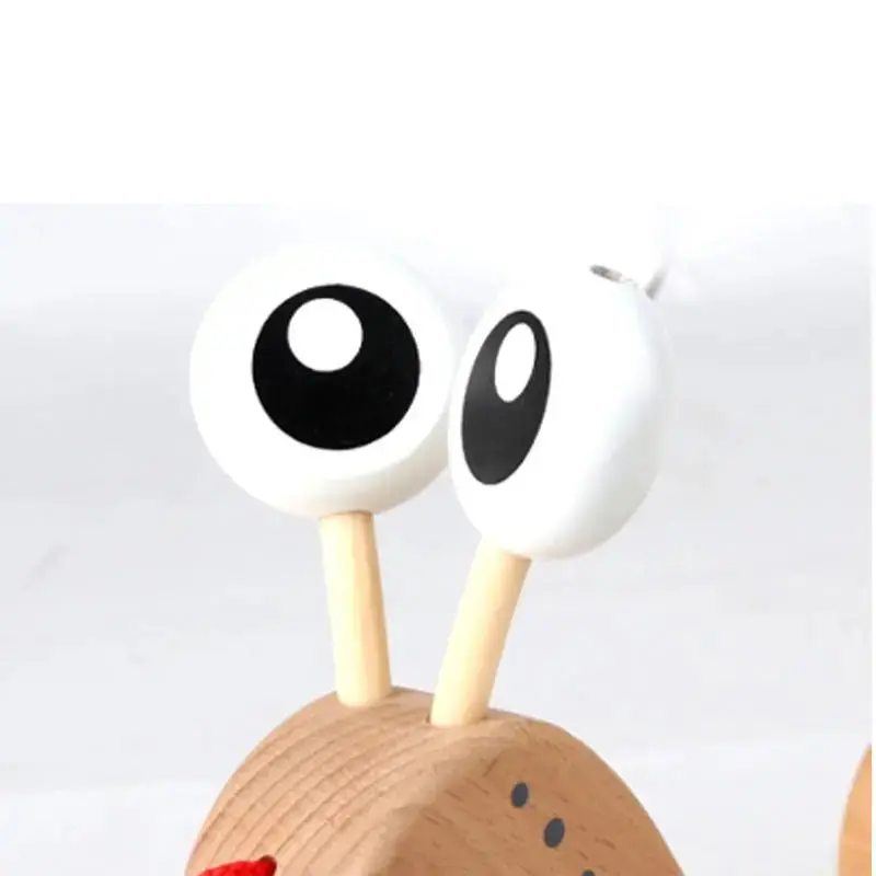 Hape Walk-A-Long Snail Toddler Wooden Pull Toy - Image 7